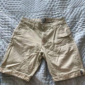 Vans tan shorts with tropical patterned accents